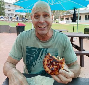 Rusty having fun with his pie at the Eurong beach bakey 